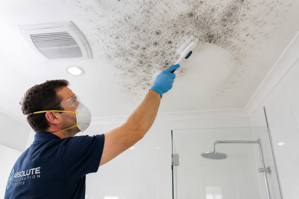 ARS technician wearing PPE during professional bathroom ceiling mould remediation in Melbourne