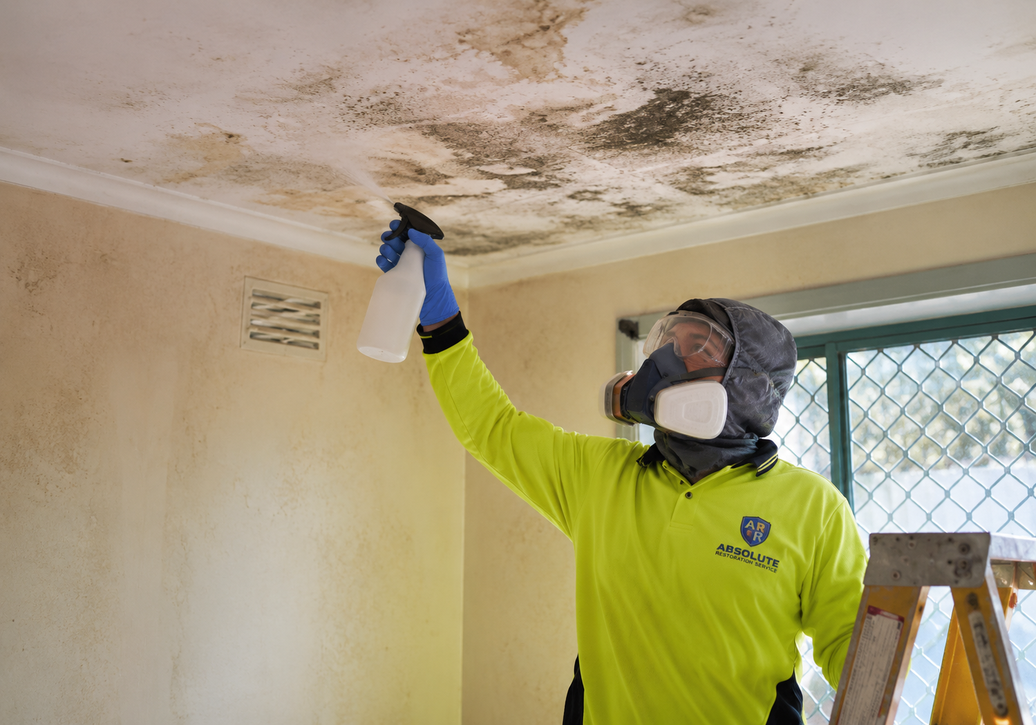 Professional mould remediation technician undertaking controlled mould removal inside a Melbourne property.